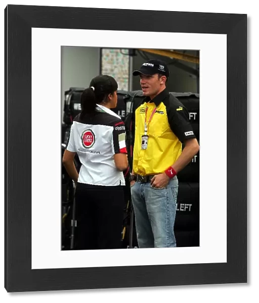 Formula One World Championship: Robert Doornbos Jordan Test Driver chats with a friend in the paddock
