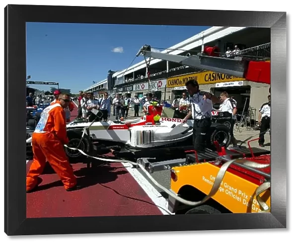 Formula One World Championship: The car of Anthony Davidson BAR Honda 006 is returned to the pits after his practice crash