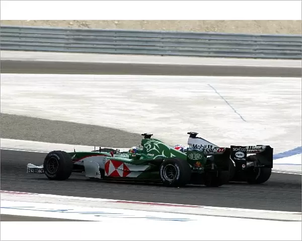 Formula One World Championship: Christian Klien Jaguar Cosworth R5 battles with Kimi Raikkonen McLaren Mercedes MP4  /  19
