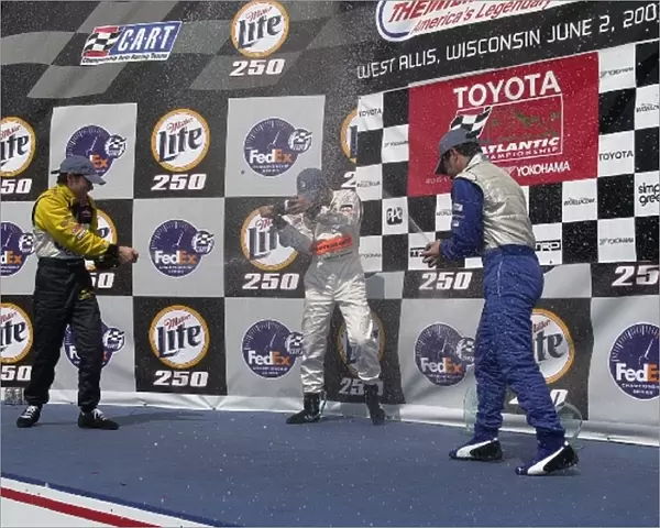 Lavi, Yasukawa, and Macri, (l to r), celebrate with champagne after the Toyota Atlantis race following the Miller Lite 250. The Milwaukee Mile, Milwaukee, Wi. 02