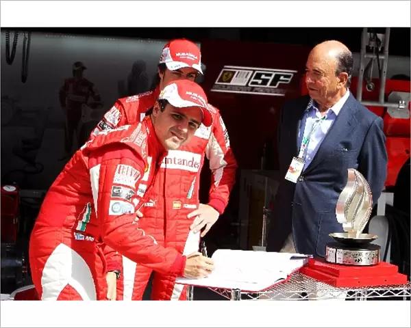 Formula One World Championship: Emilio Botin President Santander with Felipe Massa Ferrari and Fernando Alonso Ferrari and Flame On The Road