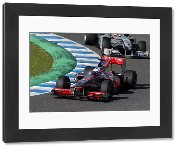 Formula One World Championship: Jenson Button McLaren MP4  /  25 leads Michael Schumacher Mercedes GP MGP W01
