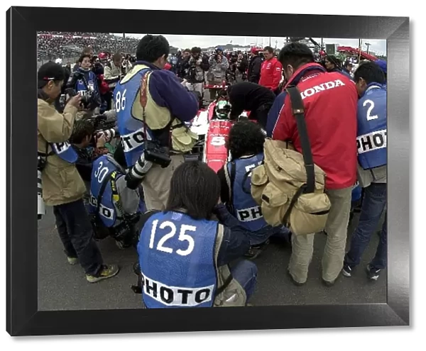 A crowd of photographers surrounds local ace Tora Takagi as he prepares to qualify for the. Bridgestone Potenza 500. Twin Ring Motegi, Motegi, Japan. 27 April, 2002