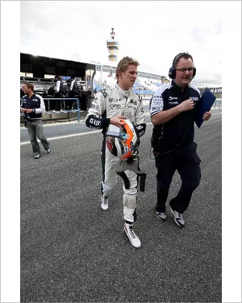 Formula One World Championship: Nico Hulkenberg Williams with Tom McCullough AT&T Williams Test Team Manager walks in after stopping on the track