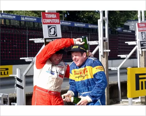 British Rally Championship: Andrew Nesbitt gives Mark Higgins some champagne