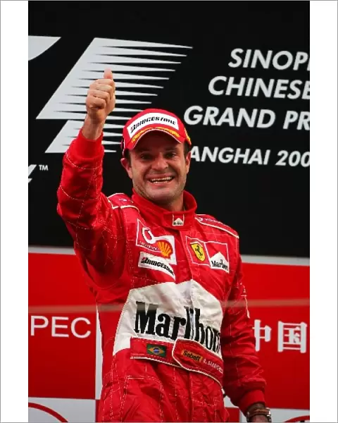 Formula One World Championship: Race winner Rubens Barrichello celebrates on the podium