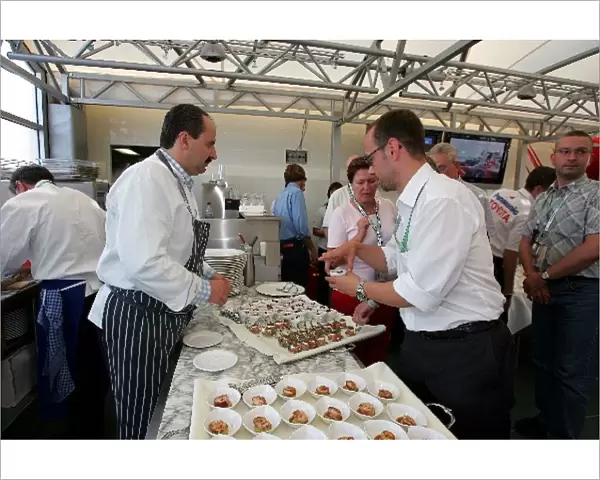 Formula One World Championship: Food is served at the Panasonic Toyota dinner in the Toyota motohome