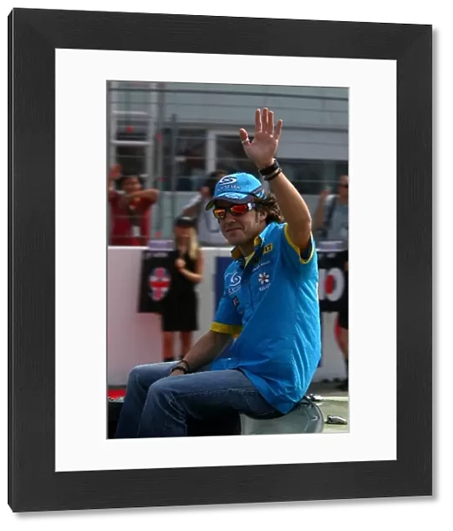 Formula One World Championship: Fernando Alonso waves to the crowd