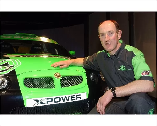 MG X Power 2002 Launch: Gwyndaf Evans poses with the Super 1600 MG ZR EX258 rally car that he will drive in the 2002 FIA Junior World Rally