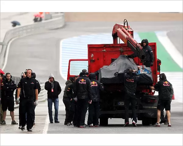 Formula One World Championship: The Red Bull Racing RB6 of Mark Webber Red Bull Racing is recovered to the pits on the back of a truck