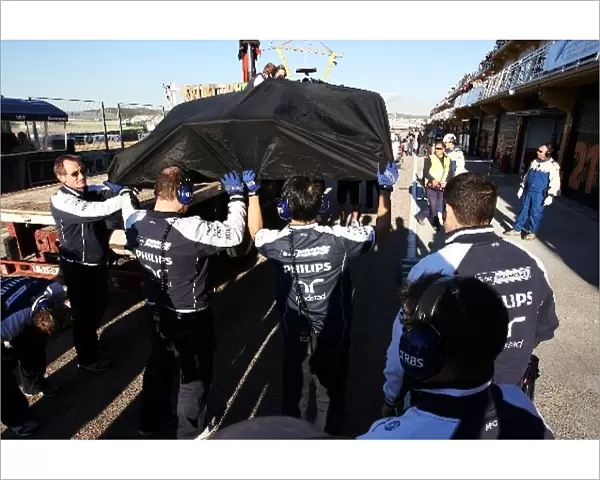 Formula One World Championship: Williams FW32 of Rubens Barrichello Williams is recovered to the pits after breaking down on track