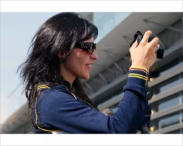 Formula One World Championship: Connie Montoya uses a Canon Powershot G5 camera in the paddock
