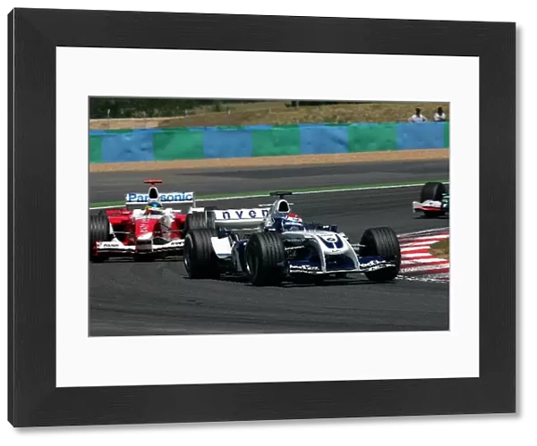 Formula One World Championship: Marc Gene Williams BMW FW26 leads Cristiano Da Matta Toyota TF104
