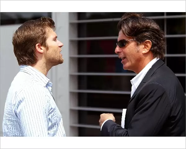 Formula One World Championship: Steve Robertson Management Team of Kimi Raikkonen McLaren talks with Enrico Zanarini Manager to Giancarlo Fisichella