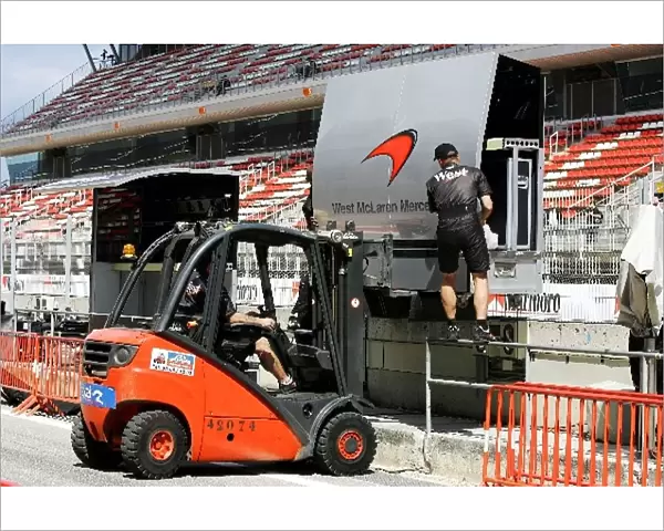 Formula One World Championship: The McLaren pit wall gantry is assembled