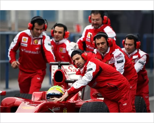 Formula One World Championship: Ferrari mechanics run to the aid of Felipe Massa Ferrari F10 as he stops at the pit lane entrance