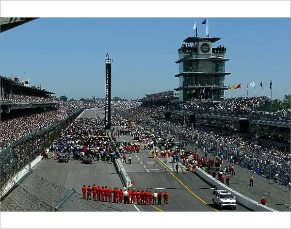 The fans and drivers salute Memorial Day at the Indianapolis 500
