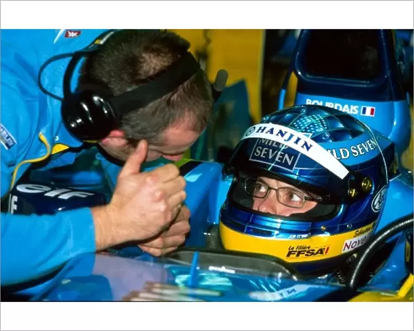 Formula One Testing: International F3000 champion Sebastien Bourdais is briefed by an engineer before taking his Renault R202 onto the ciruit