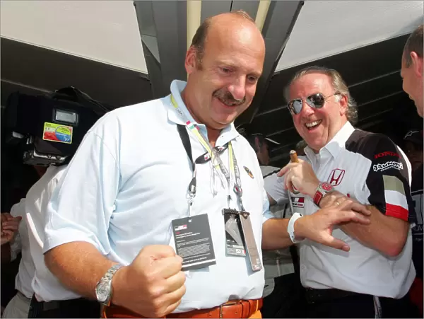 Formula One World Championship: Jimmi Rembiszewski, Marketing manager of British American Tabacco celebrates third place with David Richards