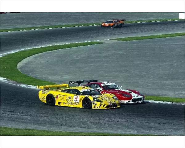FIA GT Championship: Emanuele Naspetti GPC Giesse Squadra Corse Ferrari 575 GTC battles with Walter Lechner Jr Konrad Motorsport Saleen S7-R