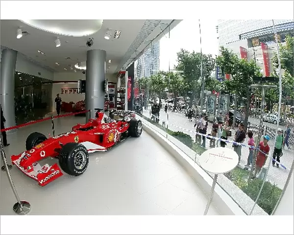 Shanghai Circuit Opening: A Ferrari F2003-GA on display in a Chinese Ferrari dealership