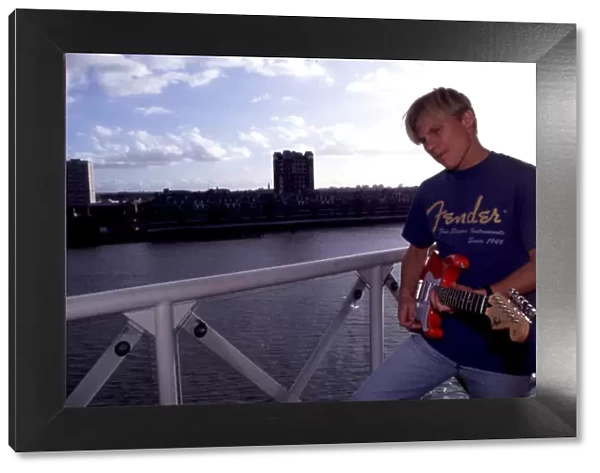 MIKA SALO AT HOME IN LONDONs DOCKLANDS SEEN HERE WITH HIS GUITAR PHOTO: LAT