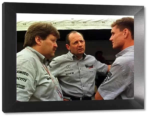 1997 SPANISH GP. David Coulthard, Ron Dennis and Norbert Haug chat outside