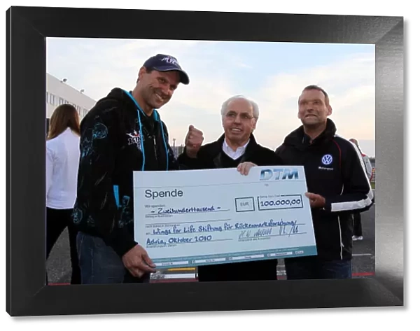 DTM. 30.10.2010 Adria, Italy - 200.000 Euro for Wings for Life Hans 