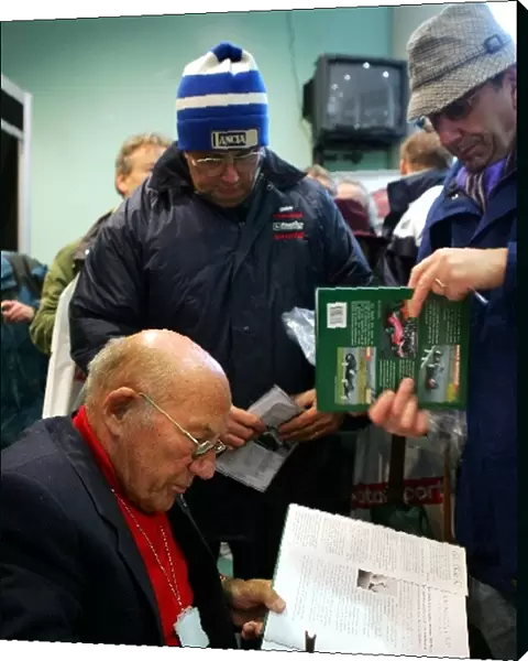 Aintree Festival of Motorsport: Sir Stirling Moss OBE signs autographs for the fans
