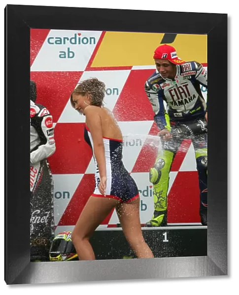 Valentino Rossi Fiat Yamaha Team sprays the podium girl with his champagne