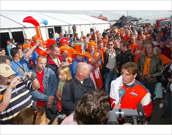 A1GP: Dutch fans salute Jeroen Bleekemolen A1 Team Netherlands as he does a TV interview