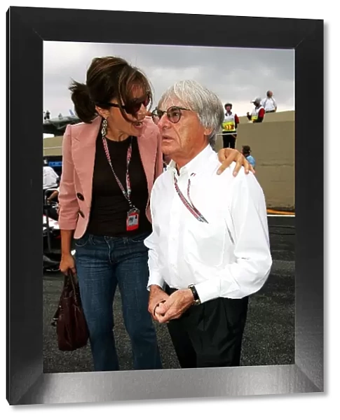 Formula One World Championship: Slavica Ecclestone with Bernie Ecclestone F1 Supremo on the grid