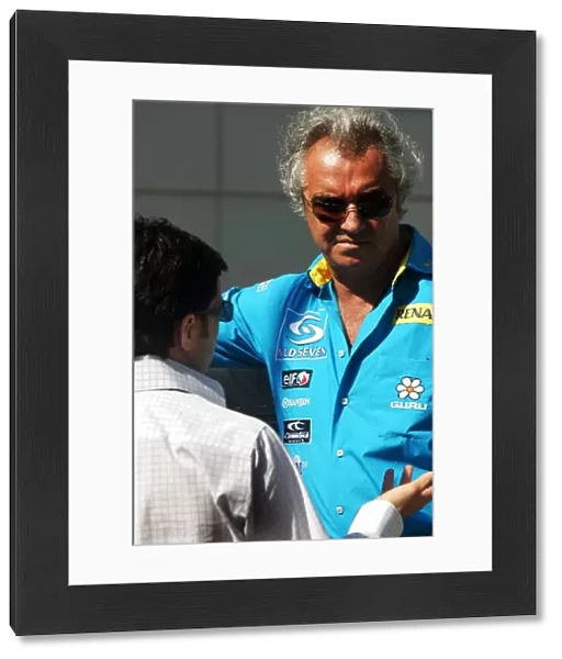 Formula One World Championship: Lucio Cavuto Manager of Jarno Trulli Toyota talks with Flavio Briatore Renault Team Principal