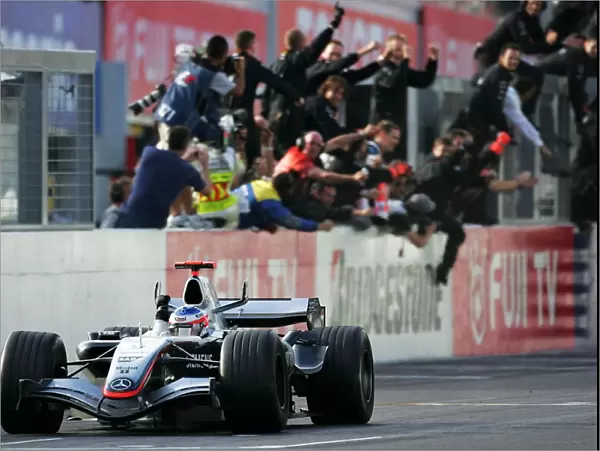 Formula One World Championship: Race winner Kimi Raikkonen McLaren Mercedes MP4  /  20 celebrates at the end of the race