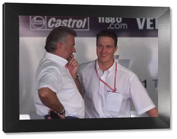 Ralf Schumacher talks with Willi Weber