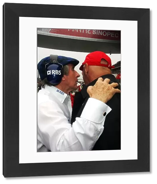 Formula One World Championship: Sir Jackie Stewart with Niki Lauda on the grid