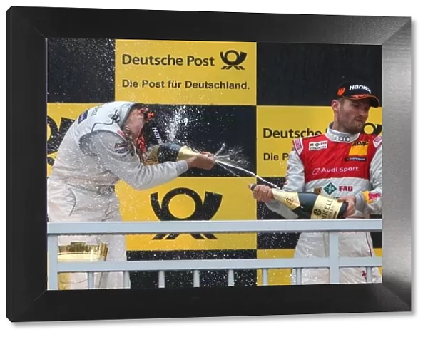 DTM. L-R: Shower of champagne for race winner Bruno Spengler 