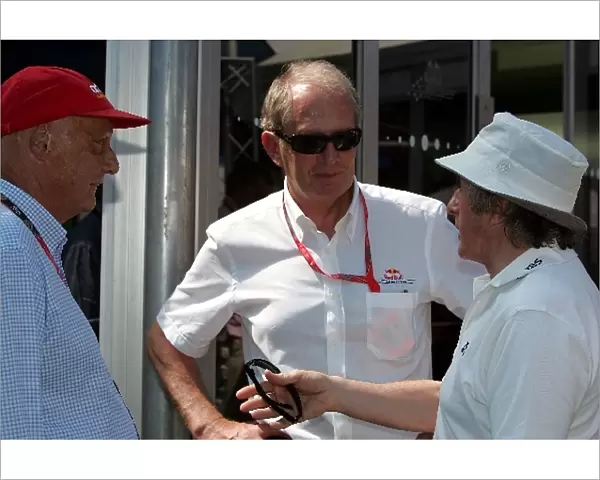 Formula One World Championship: Niki Lauda talks with Dr Helmut Marko Red Bull Motorsport Consultant and Jackie Stewart