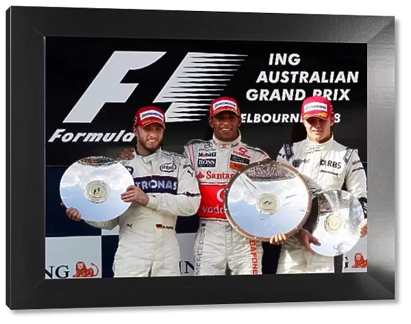 Formula One World Championship: The podium: Nick Heidfeld BMW Sauber F1, second; Lewis Hamilton McLaren, race winner; Nico Rosberg Williams, third