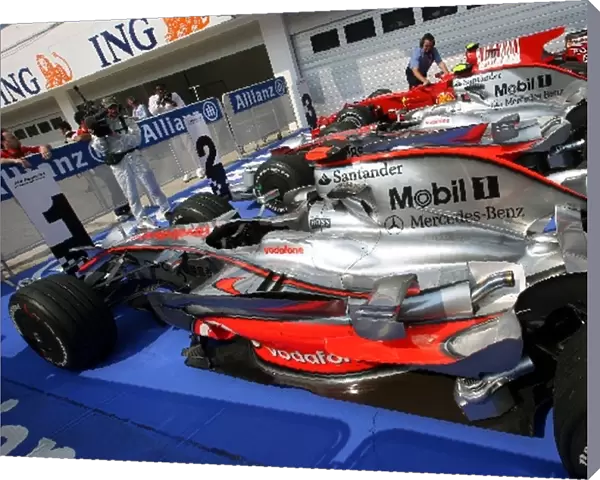 Formula One World Championship: The cars of Heikki Kovalainen McLaren, Lewis Hamilton McLaren and Felipe Massa Ferrari in parc ferme after qualifying