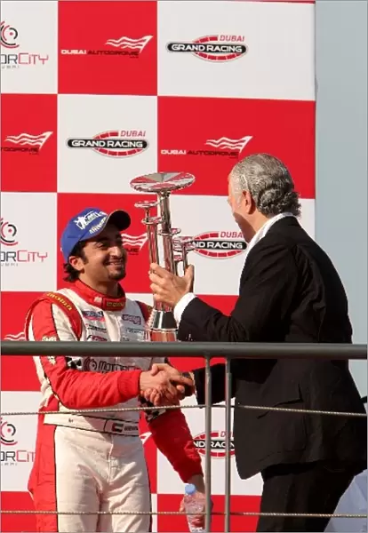 Speedcar Series: Third place Sheikh Hasher Al Maktoum receives his trophy from Simon Azzam, CEO of Union Properties on the podium