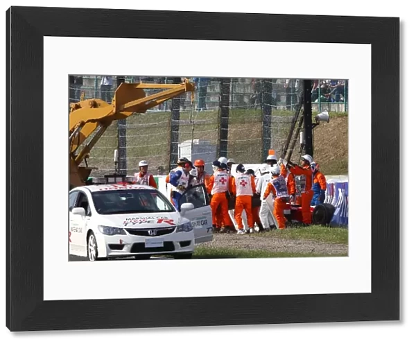 Formula One World Championship: Ambulance arrives after Timo Glock Toyota TF109 crashes during qualifying