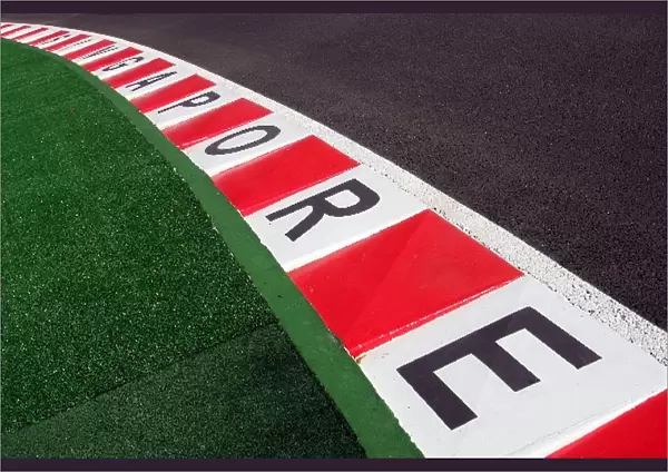 Formula One World Championship: Singapore written on the kerbs at turn 2