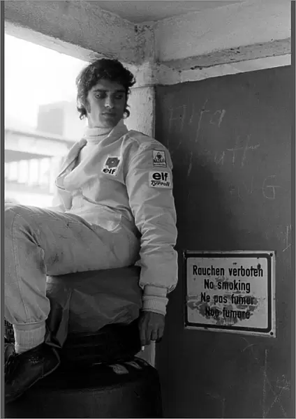 Formula One World Championship: Second placed Francois Cevert Tyrrell ignores the no smoking signs in the paddock