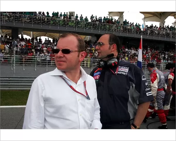 Formula One World Championship: Alex Shnaider and Dr Colin Kolles MF1Team Manager on the grid
