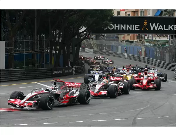 Formula One World Championship: Fernando Alonso McLaren Mercedes MP4-22 leads the field at the start