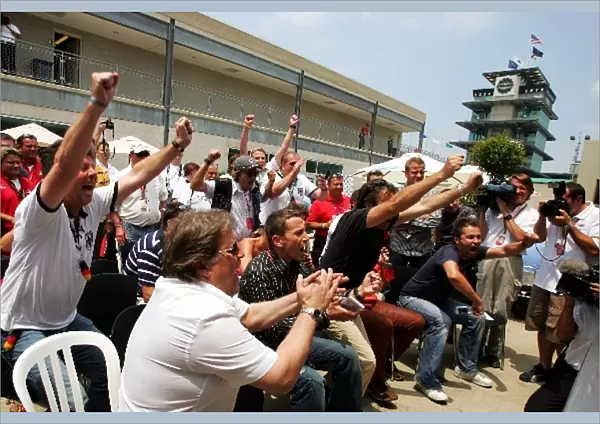 Formula One World Championship: The Germans in the paddock celebrate their penalties win over Argentina in the World Cup Quarter Final