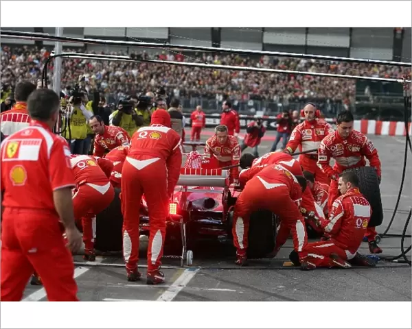 Bologna Motor Show: Marc Gene and the Ferrari team demonstrate a pit stop