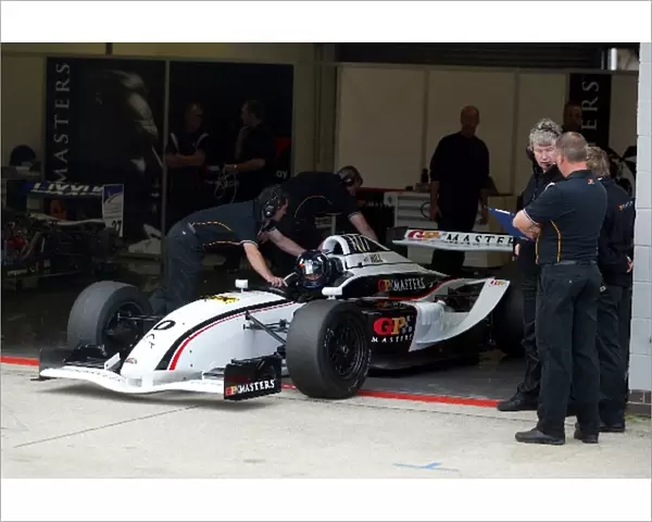 GP Masters: Damon Hill is pushed back into the garage after testing the GP Masters car