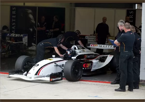 GP Masters: Damon Hill is pushed back into the garage after testing the GP Masters car